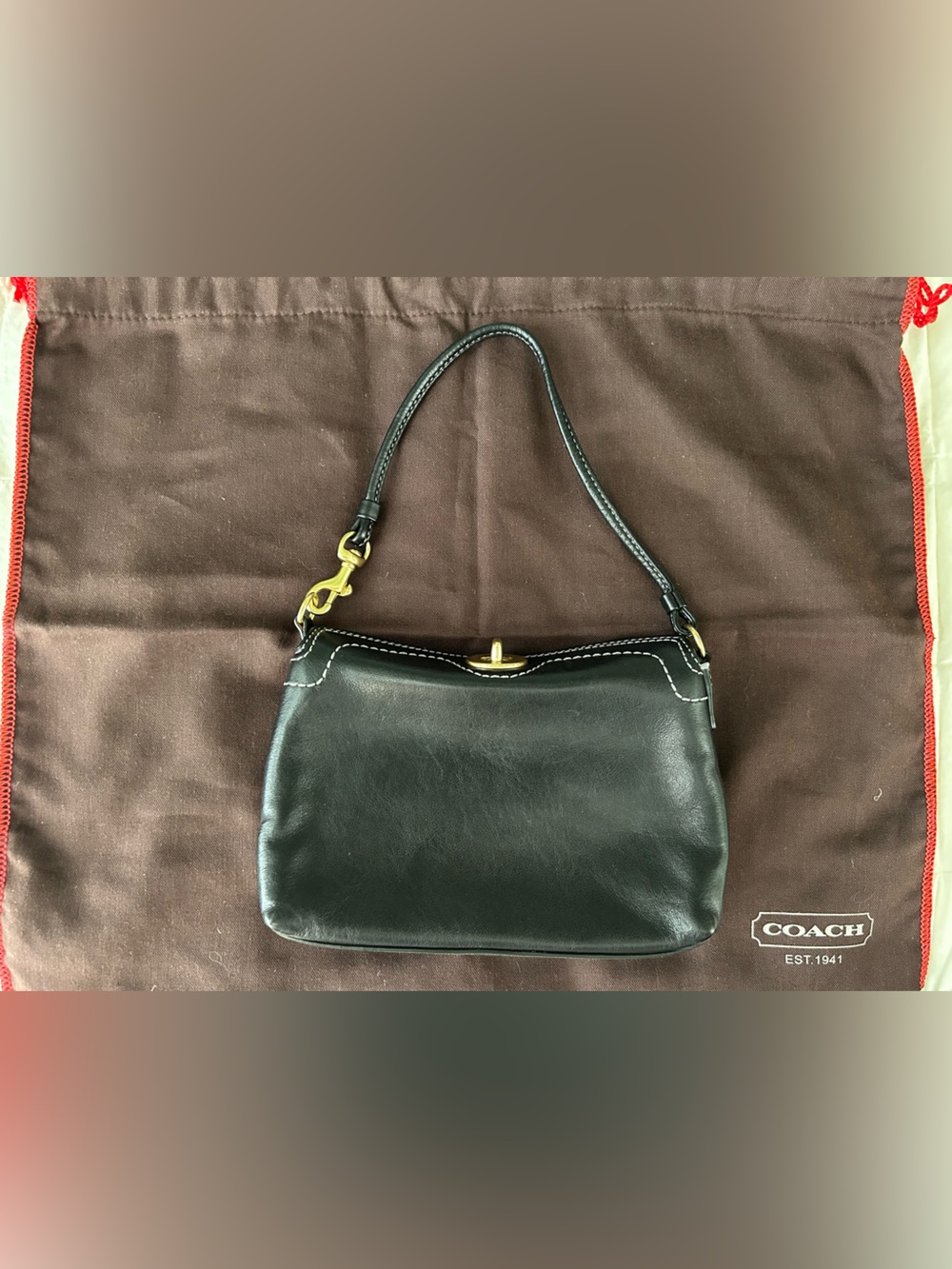 Coach Black Leather wristlet with Gold Hardware